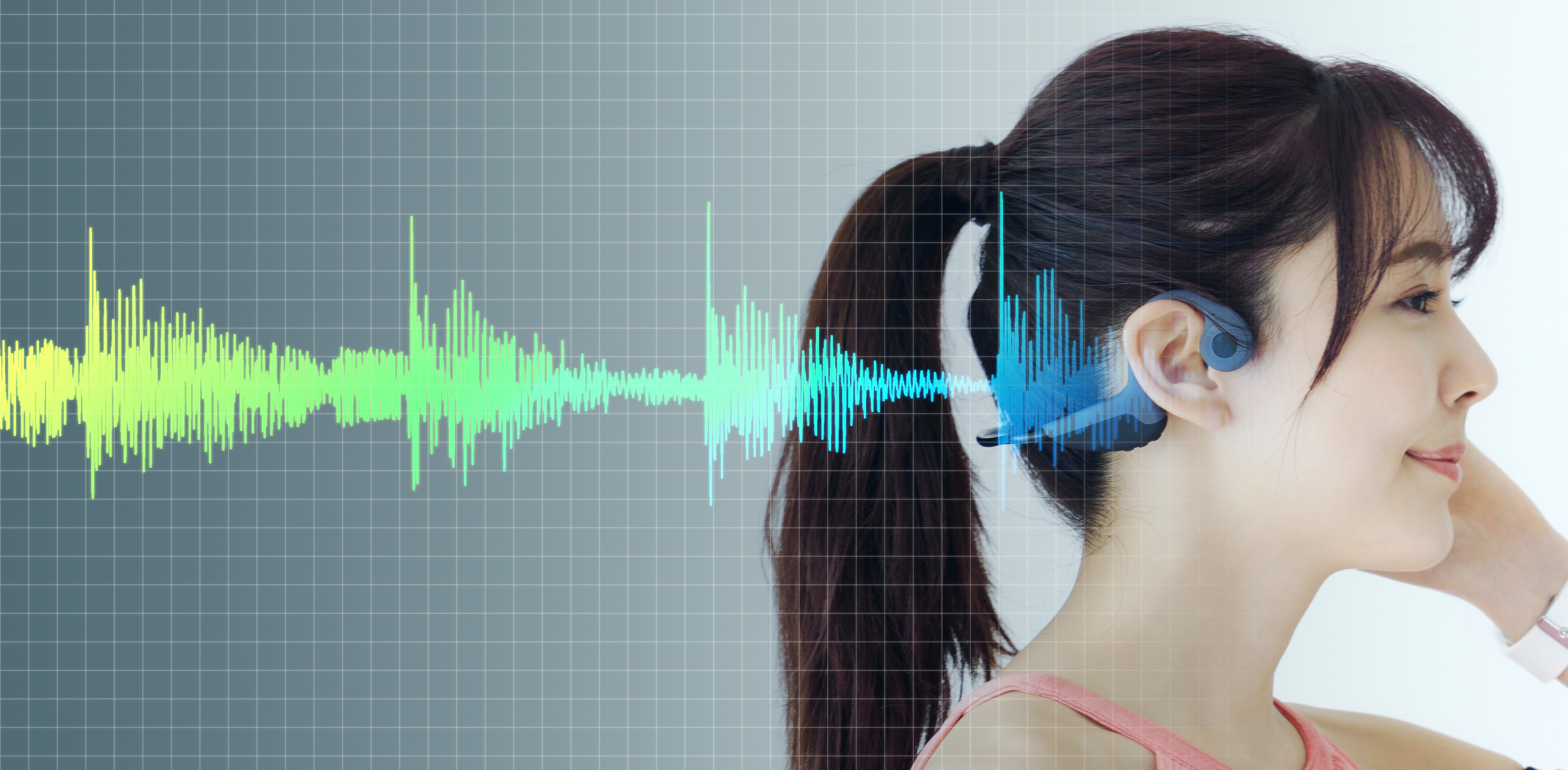 Young woman wearing a bone conduction headphones.